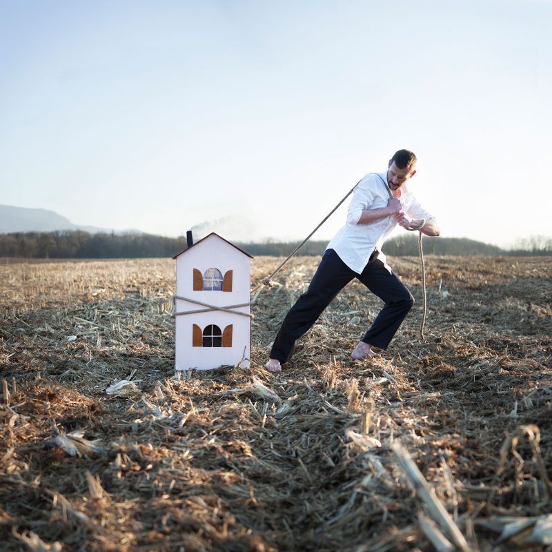 Delphine Millet Man with a home - Staged photography delicate sensitive house field weight surrealist - Art conceptual photographer in Berlin